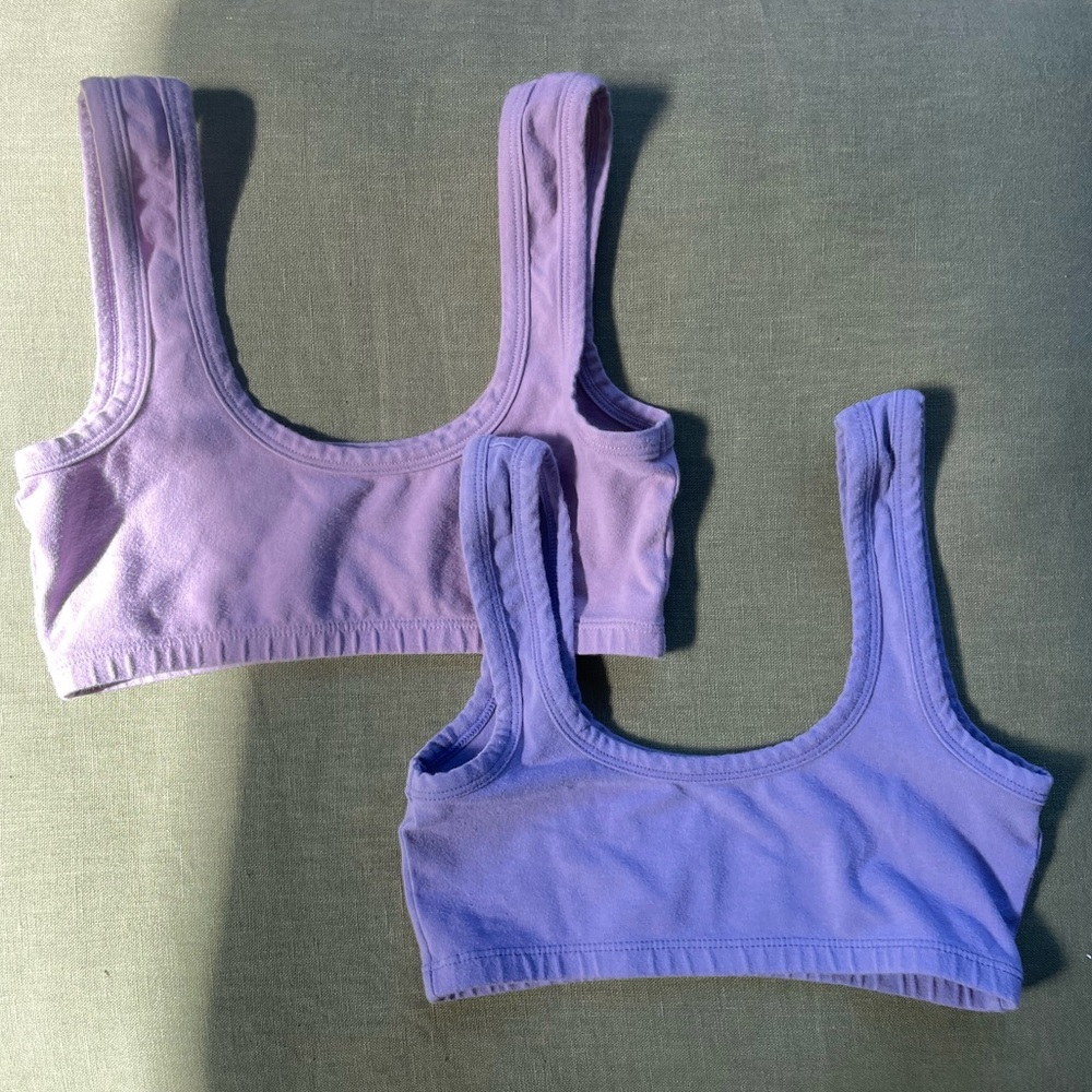 Two ARQ wide strap bras